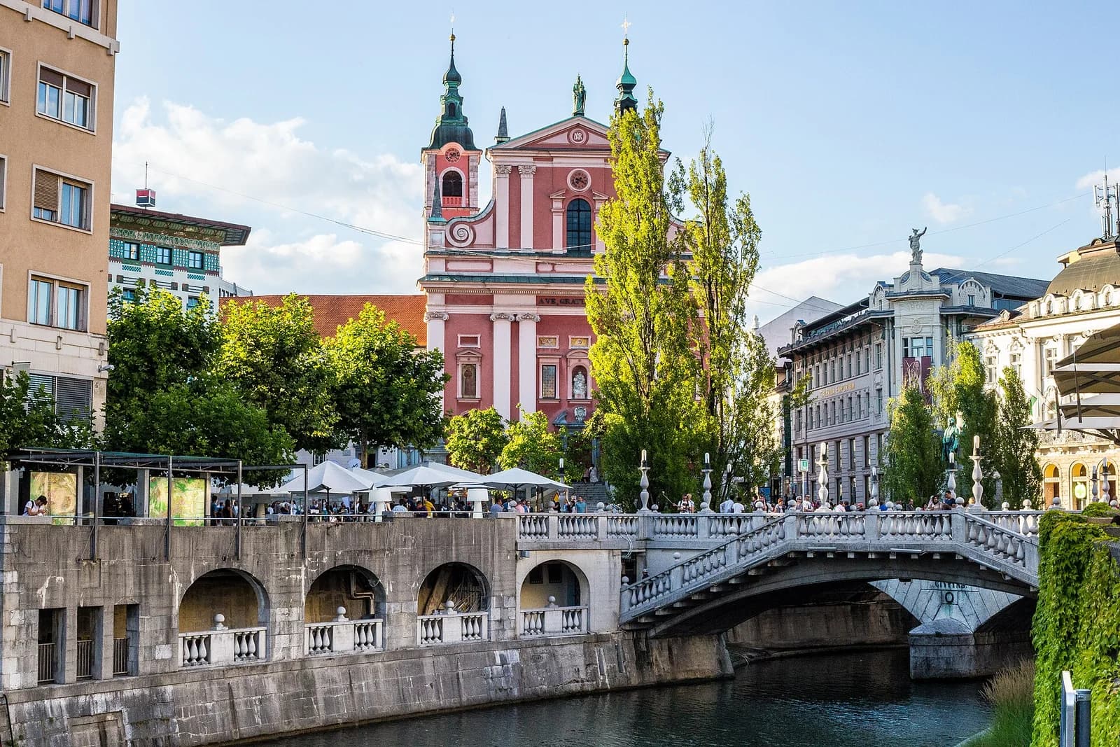 Ljubljana’s Triple Bridge and the Franciscan Church reflected in the Ljubljanica River